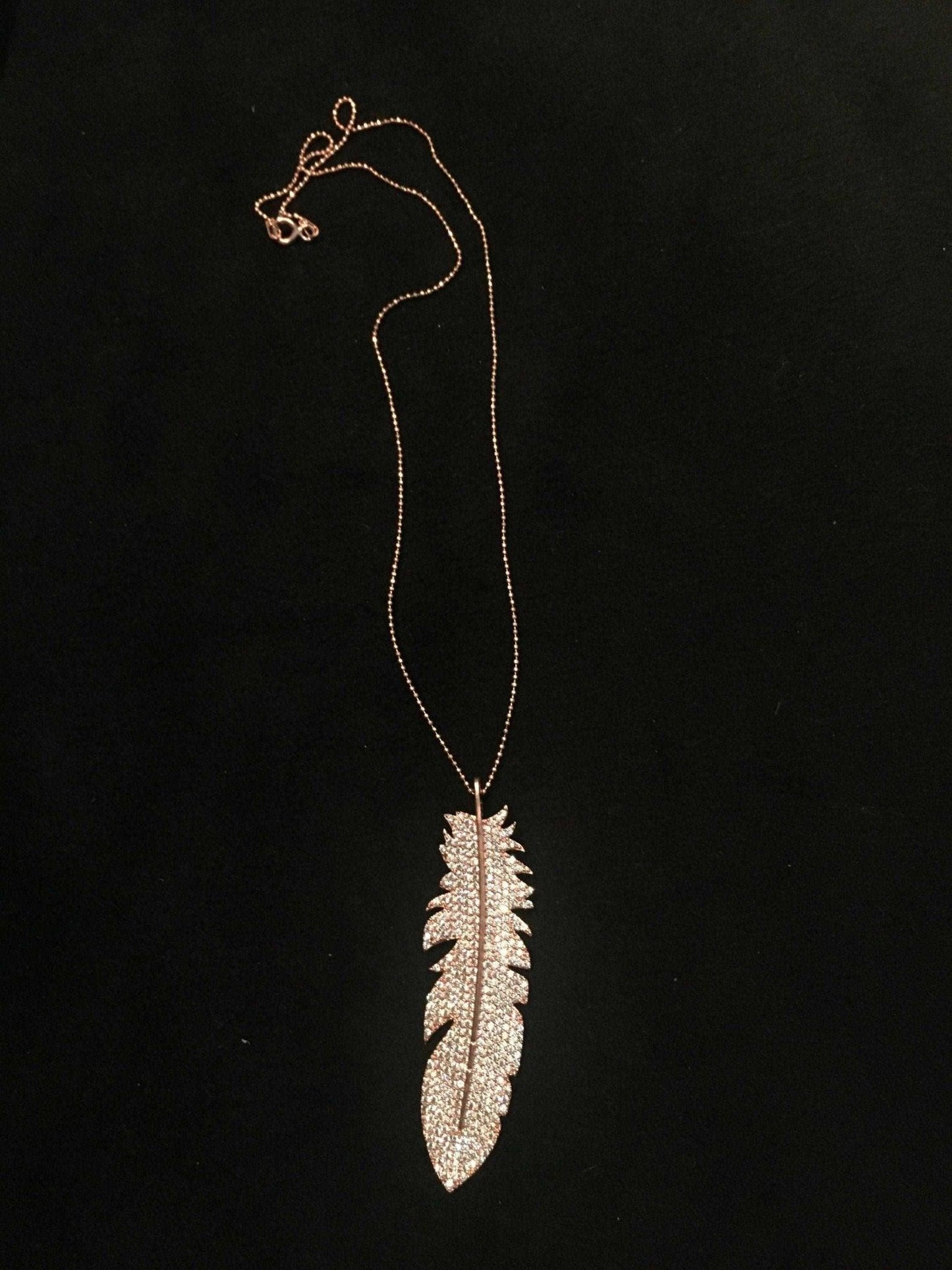 Feather Silver Necklace Custom Desing White Zircon Gemstone Rose Gold We designed it in the form of a feather decorated with diamond cut zircon stones on 925 Sterling silver. It is a bright and impressive eye-catching necklace. All stoFeather Silver Necklace