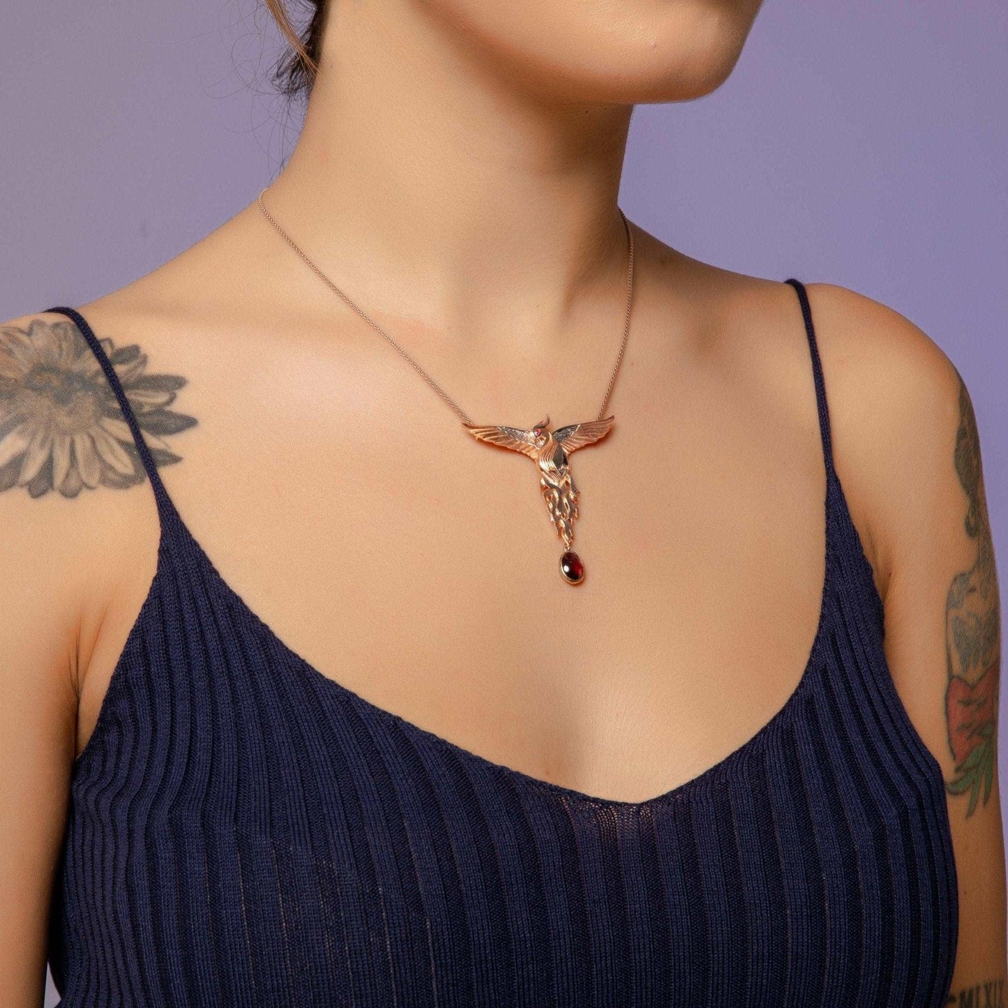 Phoenix Strength Root Ruby Pendant, Firebird Handmade 925 Sterling SilOur phoenix is 925 sterling silver and it is completely handcrafted. The eyes you see on it are decorated with red emeralds. It is specially designed to open and cPhoenix Strength Root Ruby
