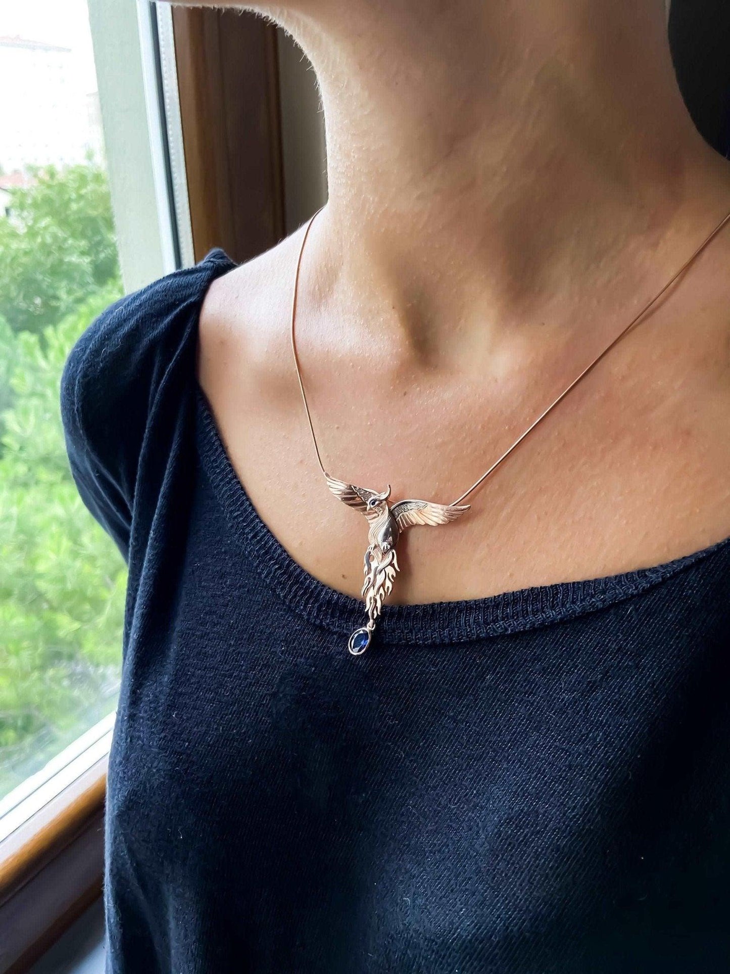 Phoenix Strength Sapphire Stone Firebird 925 Sterling Silver Pendant, Sapphire Gemstone Our phoenix is 925 sterling silver and it is completely handcrafted. The eyes you see on it are decorated with Blue sapphire. It is specially desPhoenix Strength Sapphire Stone