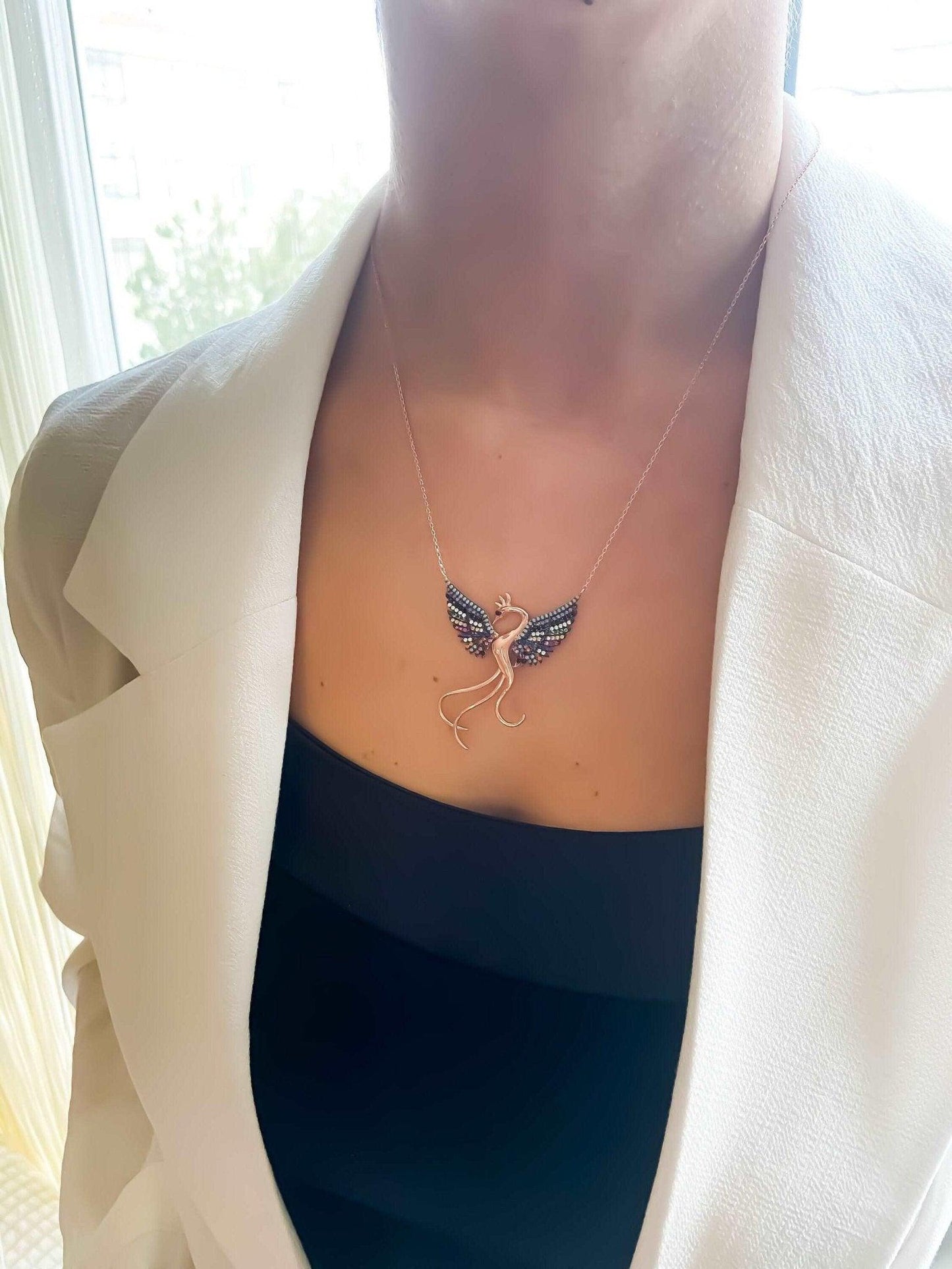 Rainbow Phoenix Necklace,Custom Desing Firebird Handmade Jewelry StrenWe designed our 925 carat fire bird necklace for you. It is completely handcrafted and made of sterling silver. It is decorated with rose gold and colored zircon stoRainbow Phoenix Necklace