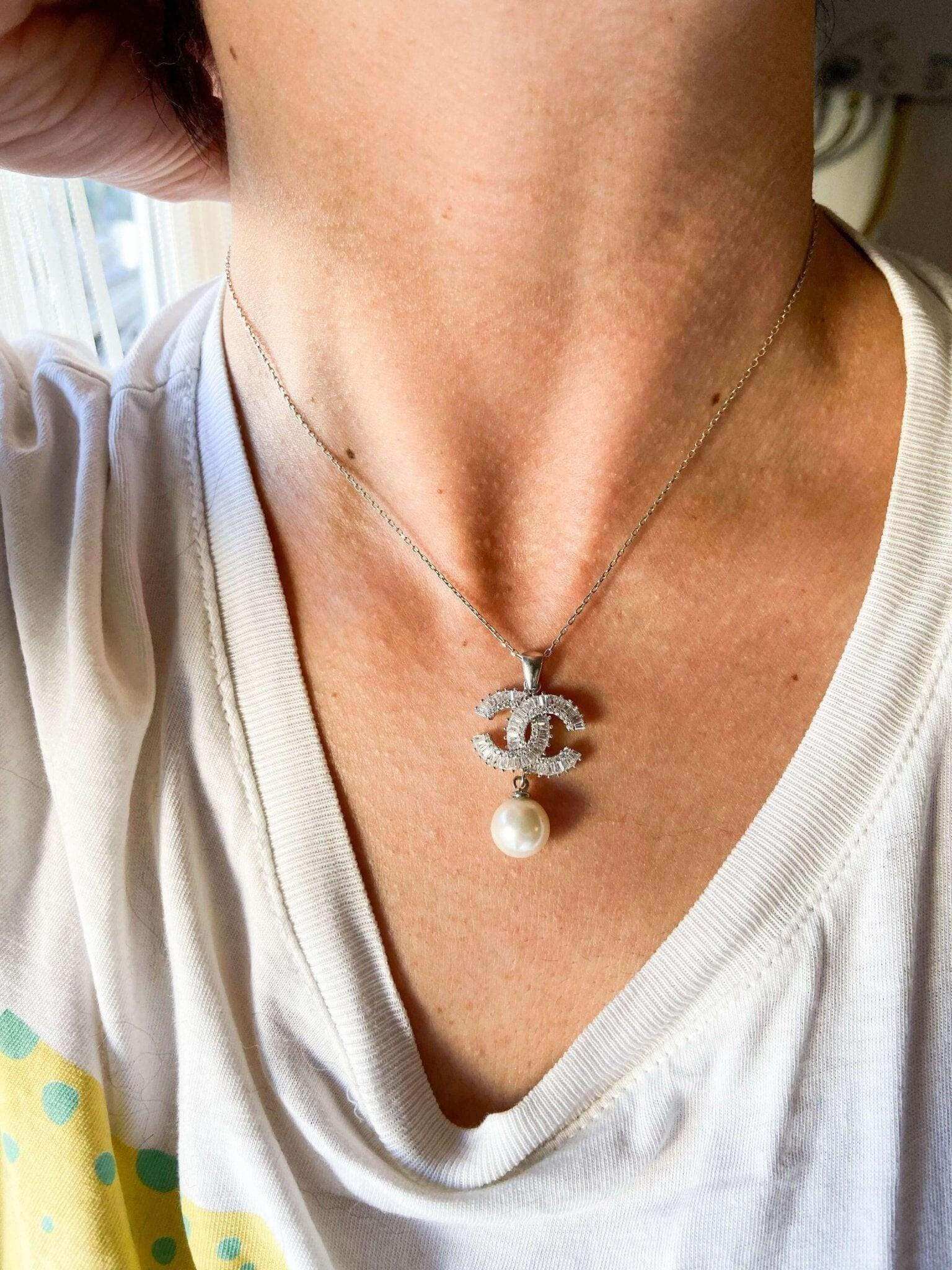 Authentic Chanel Jewelry 925 sterling silver necklace with Chanel logo and pearl pendant