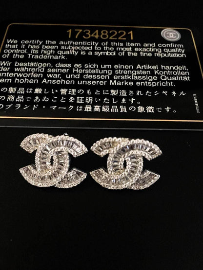 Authentic Chanel 925 sterling silver earrings with zircon stones and certification card