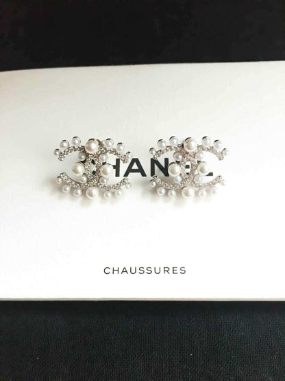 Authentic Chanel Pearl stud earrings in 925 sterling silver with rose gold and imported Italian stones
