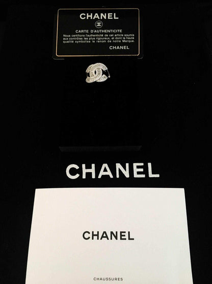 Authentic Chanel ring in 925 sterling silver with white zircon baguette stones and Chanel authenticity card