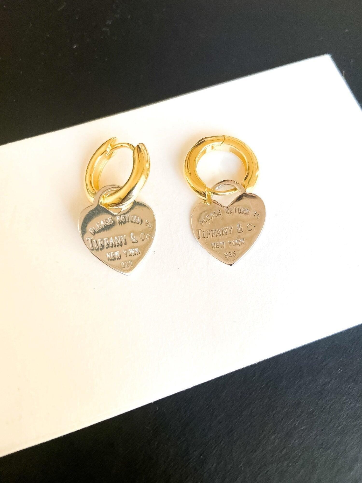 925 Sterling Silver Tiffany & Co Gold Planet Jewelry Heart Earrings on display with a white background.