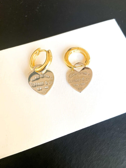 925 Sterling Silver Tiffany & Co Gold Planet Jewelry Heart Earrings on display with a white background.