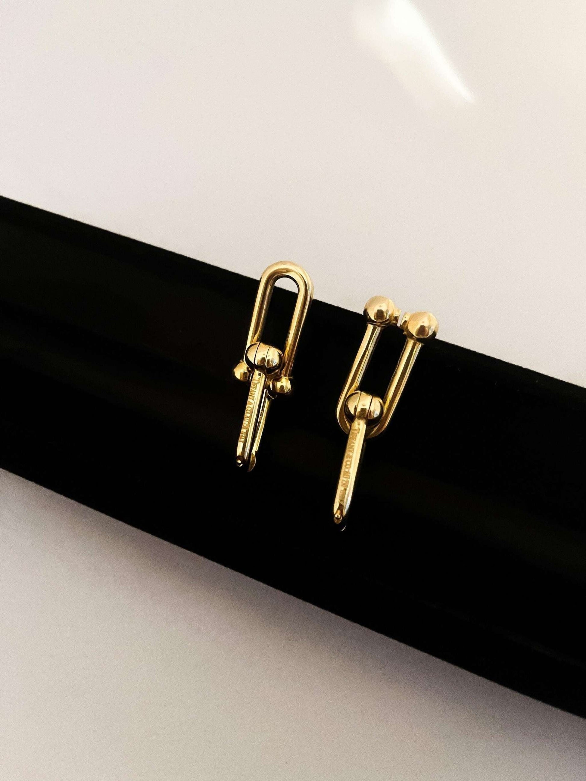 Tiffany&Co 925 sterling silver gold plated elegant women's earrings on black display
