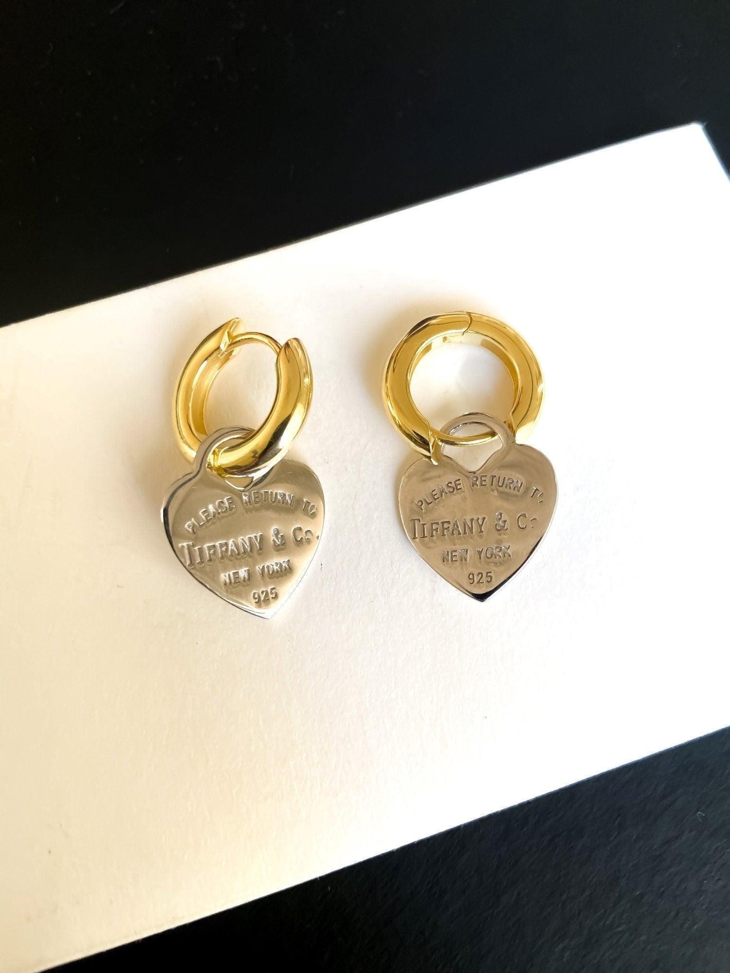 925 Sterling Silver Tiffany & Co Gold Planet Jewelry Heart Earrings on display with hallmark details
