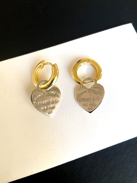 925 Sterling Silver Tiffany & Co Gold Planet Jewelry Heart Earrings on display with hallmark details