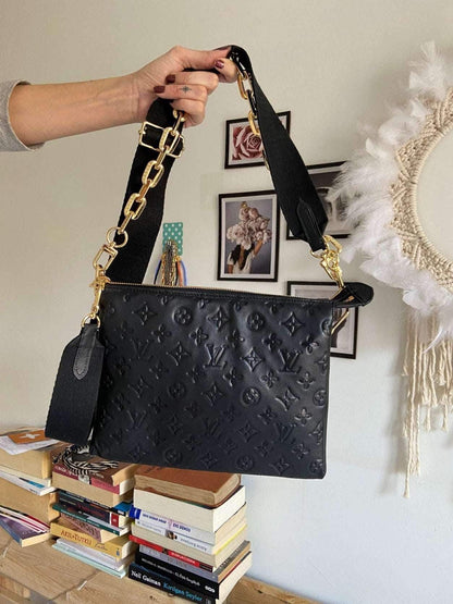 Black Louis Vuitton COUSSIN PM handbag in monogram-embossed puffy lambskin with gold hardware and removable strap