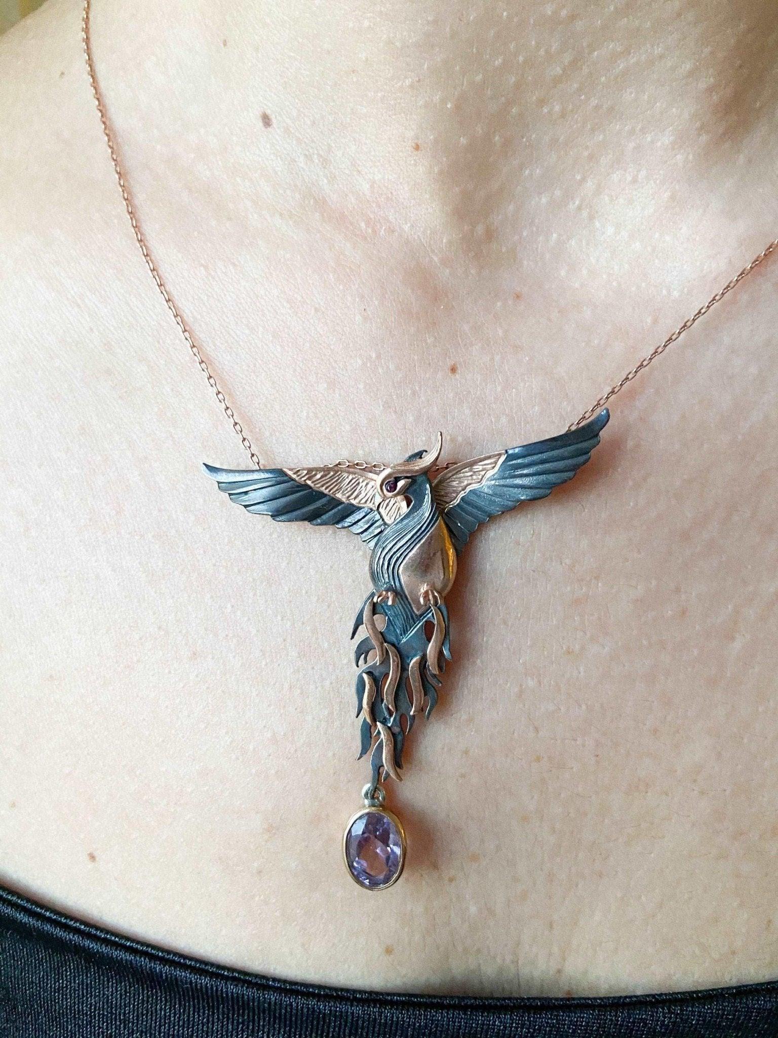 Amethyst Stone Fire Bird Pendant, Custom Desing Phoenix 925 Sterling SAmethyst Gemstone Our phoenix is ​​925 sterling silver and it is completely handcrafted. The eyes you see on it are decorated with red emeralds. It is specially desiAmethyst Stone Fire Bird Pendant