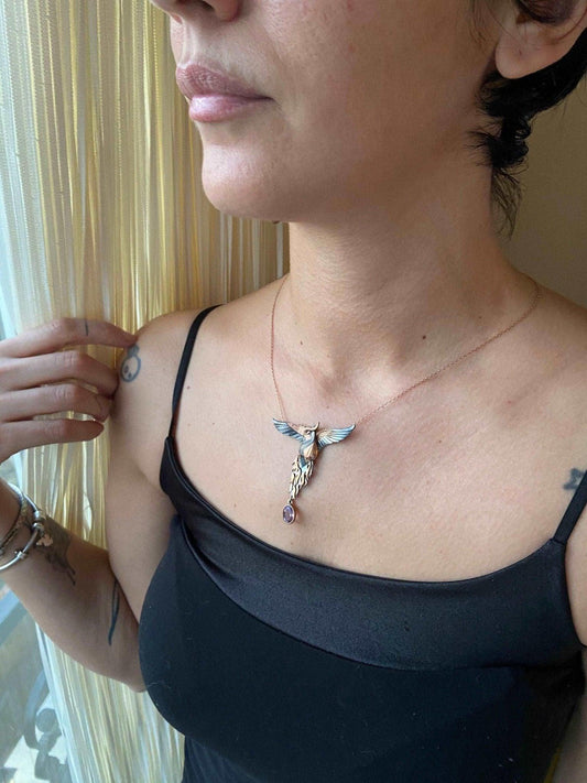 Amethyst Stone Fire Bird Pendant, Custom Desing Phoenix 925 Sterling SAmethyst Gemstone Our phoenix is ​​925 sterling silver and it is completely handcrafted. The eyes you see on it are decorated with red emeralds. It is specially desiAmethyst Stone Fire Bird Pendant