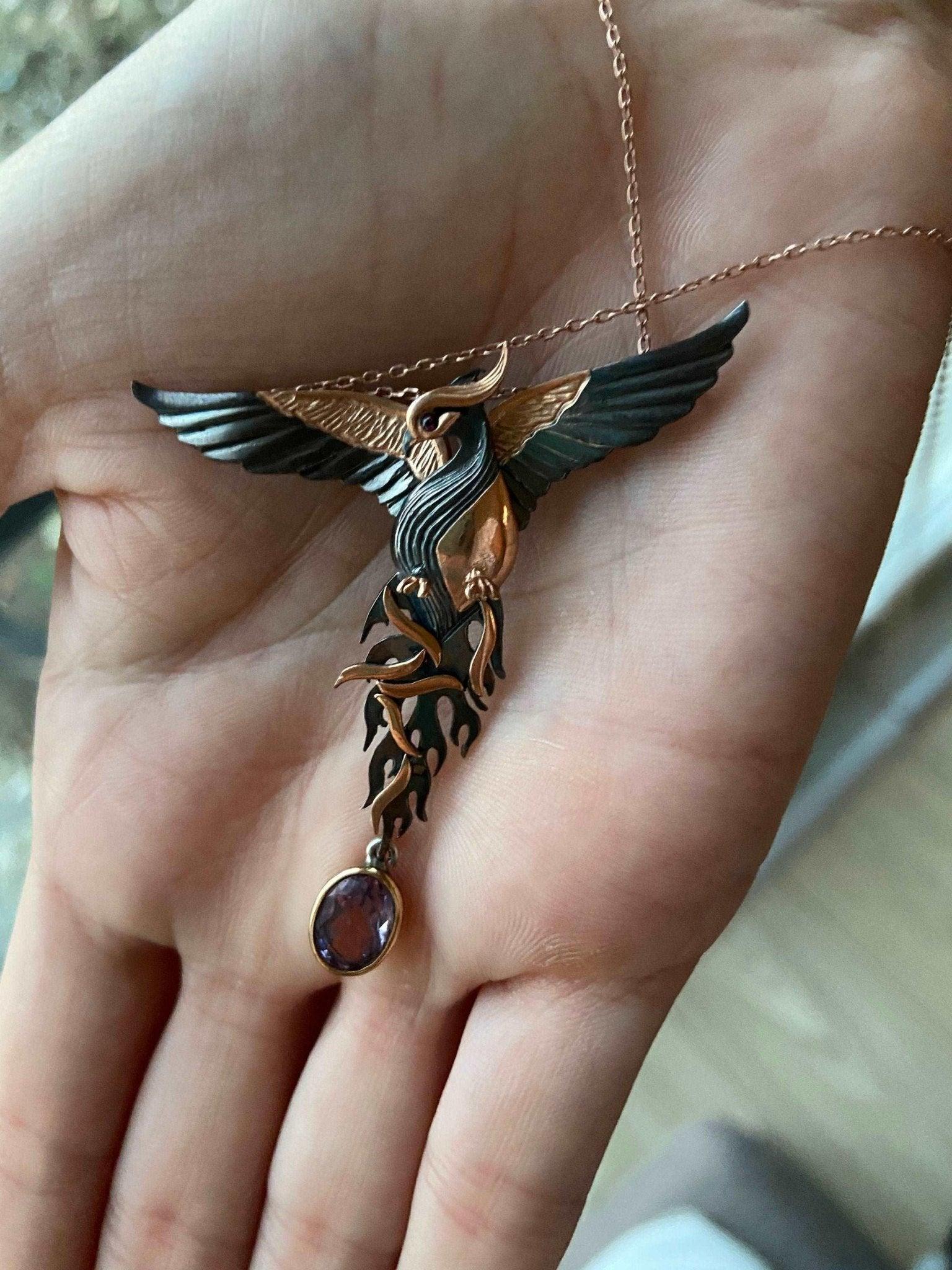 Amethyst Stone Fire Bird Pendant, Custom Desing Phoenix 925 Sterling SAmethyst Gemstone Our phoenix is ​​925 sterling silver and it is completely handcrafted. The eyes you see on it are decorated with red emeralds. It is specially desiAmethyst Stone Fire Bird Pendant