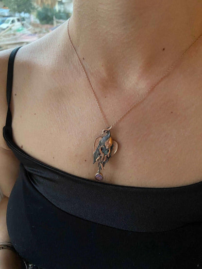 Amethyst Stone Fire Bird Pendant, Custom Desing Phoenix 925 Sterling SAmethyst Gemstone Our phoenix is ​​925 sterling silver and it is completely handcrafted. The eyes you see on it are decorated with red emeralds. It is specially desiAmethyst Stone Fire Bird Pendant