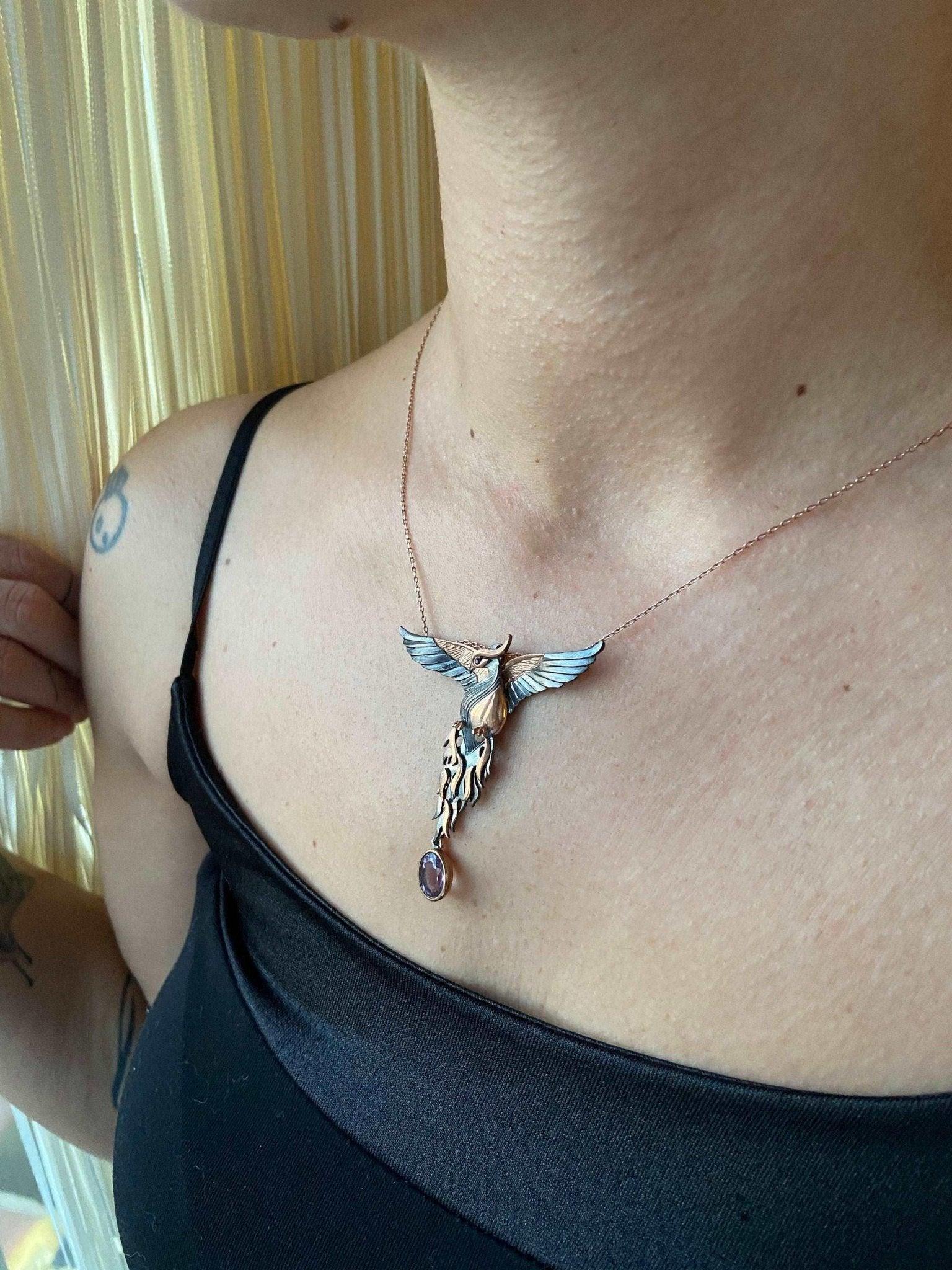 Amethyst Stone Fire Bird Pendant, Custom Desing Phoenix 925 Sterling SAmethyst Gemstone Our phoenix is ​​925 sterling silver and it is completely handcrafted. The eyes you see on it are decorated with red emeralds. It is specially desiAmethyst Stone Fire Bird Pendant