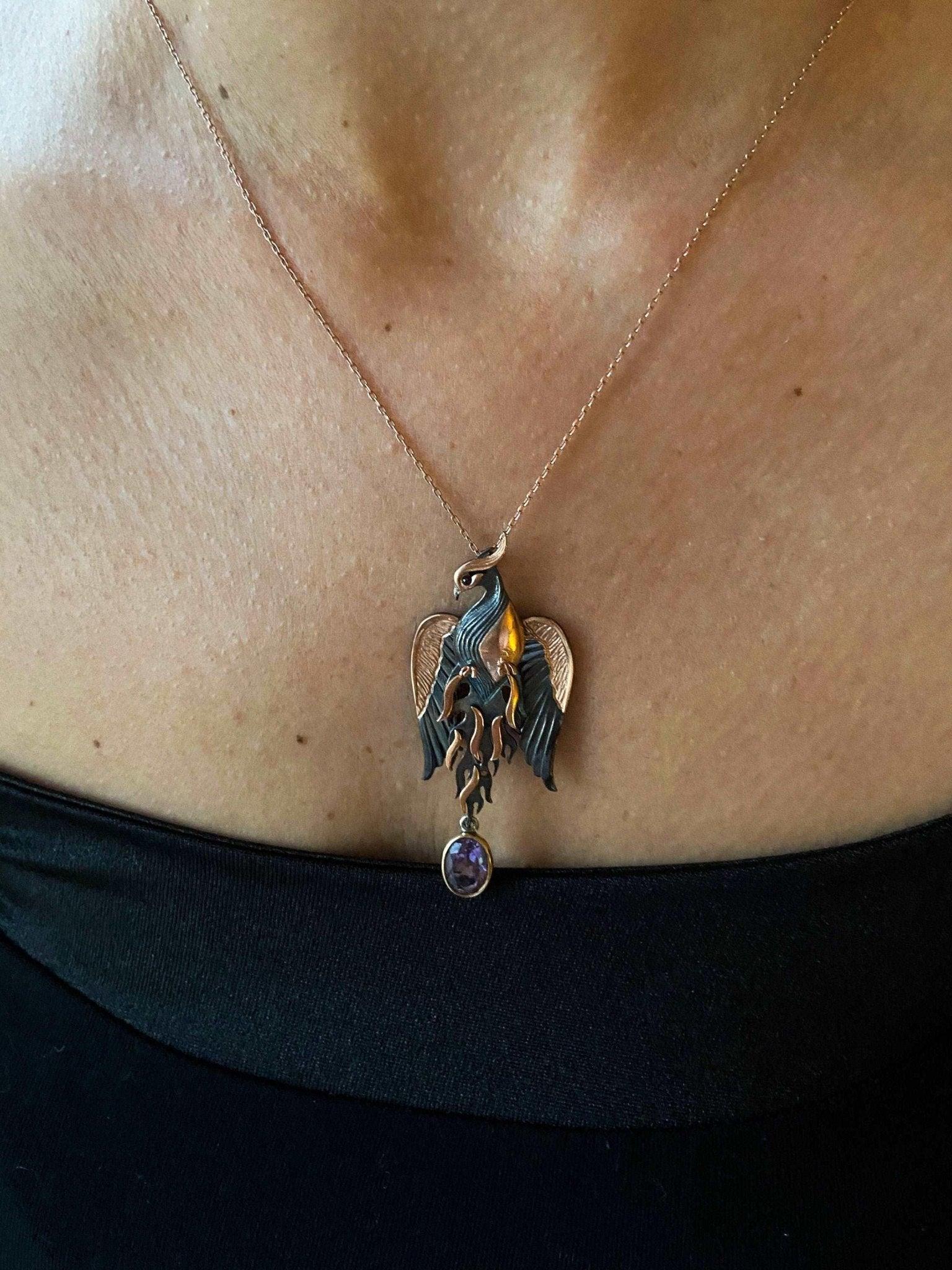 Amethyst Stone Fire Bird Pendant, Custom Desing Phoenix 925 Sterling SAmethyst Gemstone Our phoenix is ​​925 sterling silver and it is completely handcrafted. The eyes you see on it are decorated with red emeralds. It is specially desiAmethyst Stone Fire Bird Pendant