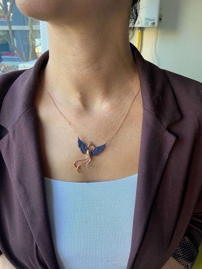 Blue Phoenix Handmade Necklace, Bird Jewelry Rose Gold Firebird PendanWe designed our 925 firebird necklace for you. It is completely handcrafted and made of sterling silver. It is decorated with rose gold and Purple colored zircon stoBlue Phoenix Handmade Necklace