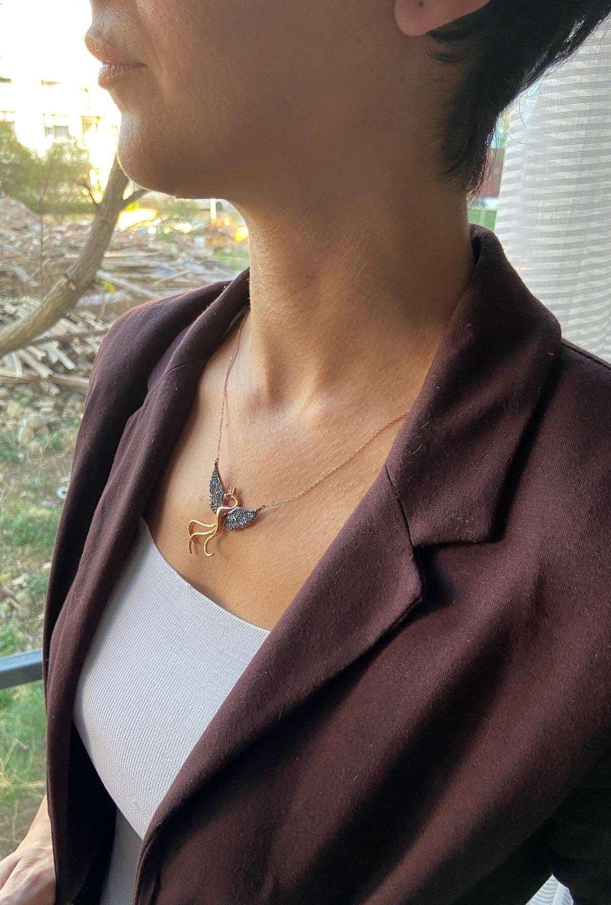Blue Phoenix Handmade Necklace, Bird Jewelry Rose Gold Firebird PendanWe designed our 925 firebird necklace for you. It is completely handcrafted and made of sterling silver. It is decorated with rose gold and Purple colored zircon stoBlue Phoenix Handmade Necklace