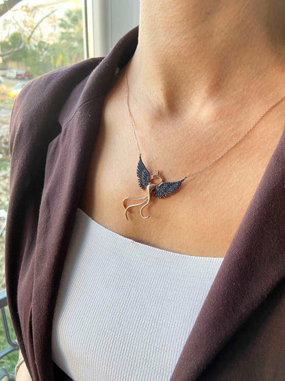 Blue Phoenix Handmade Necklace, Bird Jewelry Rose Gold Firebird PendanWe designed our 925 firebird necklace for you. It is completely handcrafted and made of sterling silver. It is decorated with rose gold and Purple colored zircon stoBlue Phoenix Handmade Necklace