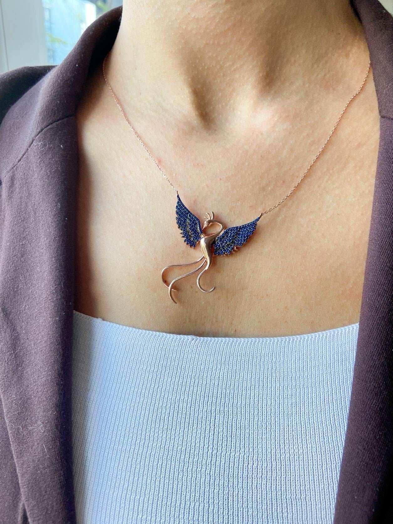 Blue Phoenix Handmade Necklace, Bird Jewelry Rose Gold Firebird PendanWe designed our 925 firebird necklace for you. It is completely handcrafted and made of sterling silver. It is decorated with rose gold and Purple colored zircon stoBlue Phoenix Handmade Necklace