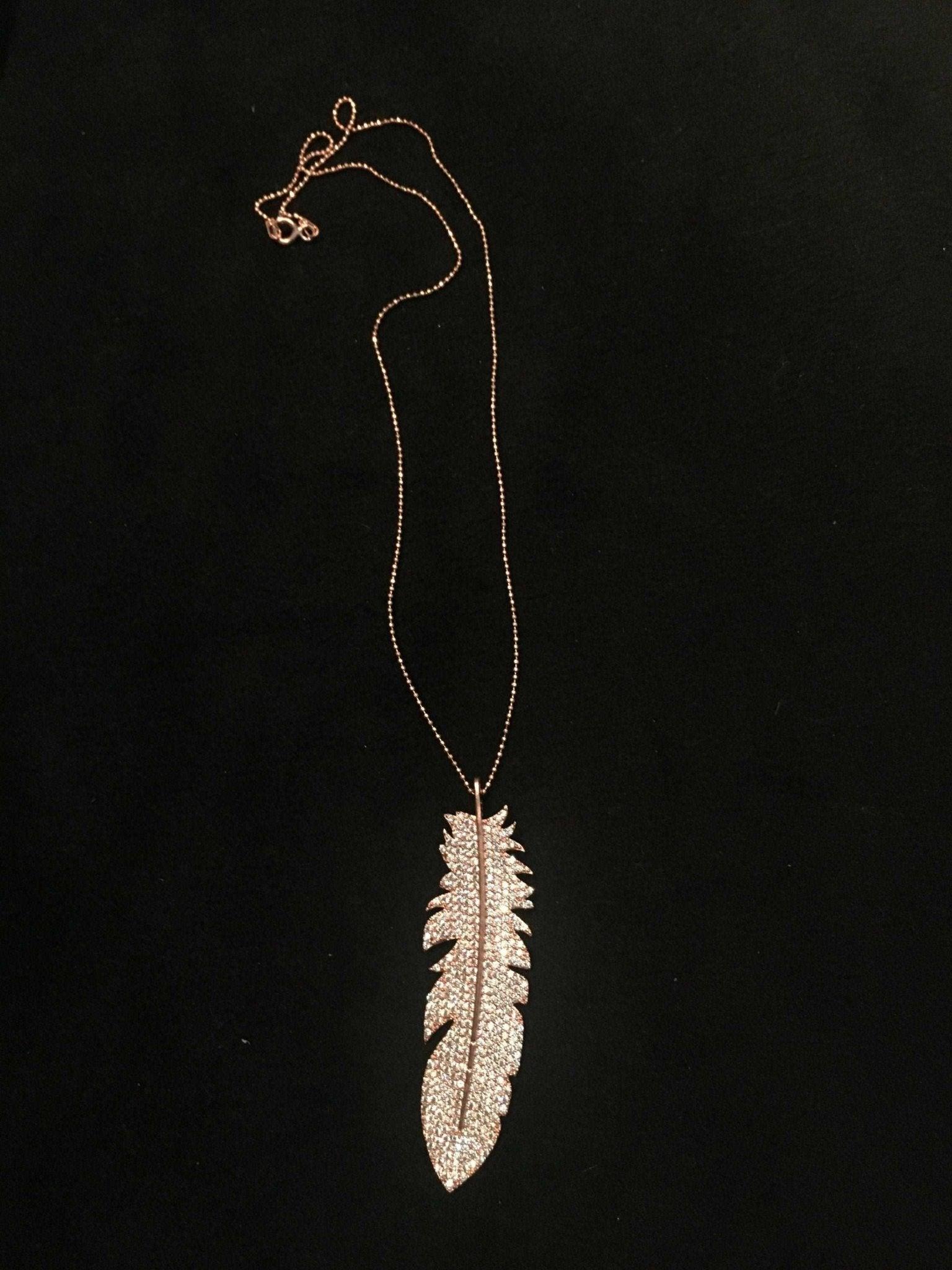 Feather Silver Necklace Custom Desing White Zircon Gemstone Rose Gold We designed it in the form of a feather decorated with diamond cut zircon stones on 925 Sterling silver. It is a bright and impressive eye-catching necklace. All stoFeather Silver Necklace