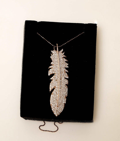 Feather Silver Necklace Custom Desing White Zircon Gemstone Rose Gold We designed it in the form of a feather decorated with diamond cut zircon stones on 925 Sterling silver. It is a bright and impressive eye-catching necklace. All stoFeather Silver Necklace
