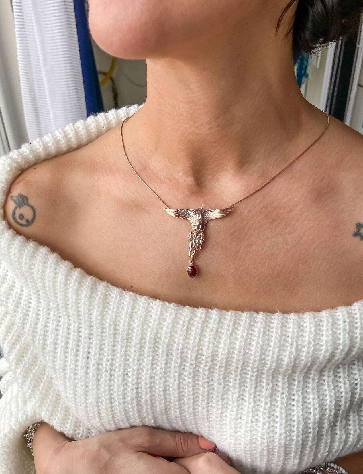 Garnet Stone Handmade Phoenix Root Ruby Eye Silver Necklace, Garnet GeGarnet Gemstone Our phoenix is ​​925 sterling silver and it is completely handcrafted. The eyes you see on it are decorated with red ruby. It is specially designed tNecklaceGarnet Stone