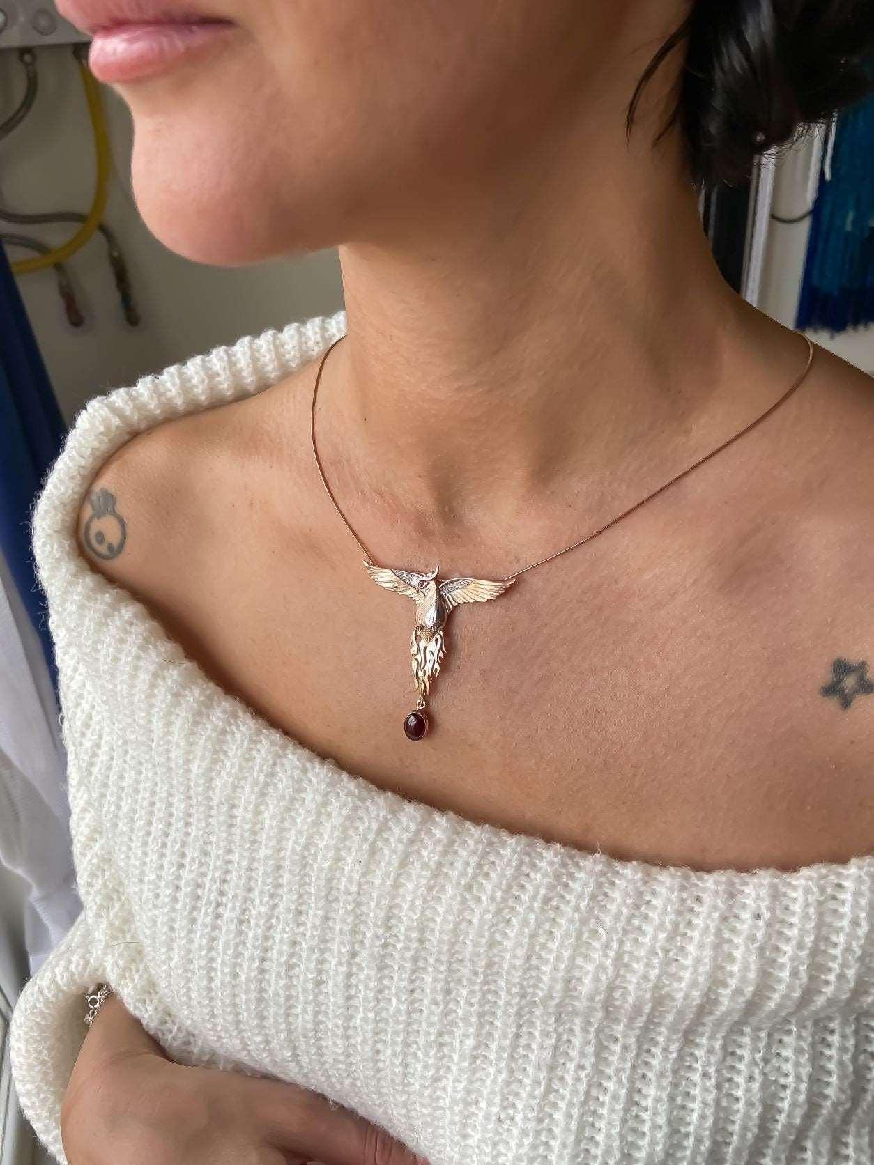 Garnet Stone Handmade Phoenix Root Ruby Eye Silver Necklace, Garnet GeGarnet Gemstone Our phoenix is ​​925 sterling silver and it is completely handcrafted. The eyes you see on it are decorated with red ruby. It is specially designed tNecklaceGarnet Stone