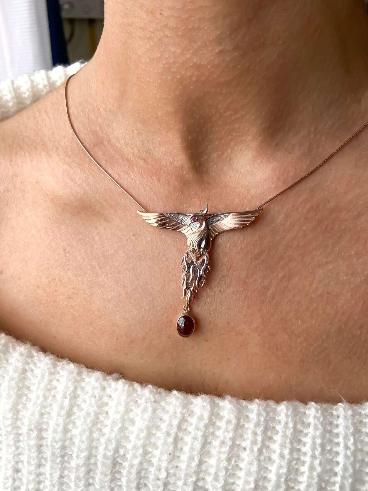 Garnet Stone Handmade Phoenix Root Ruby Eye Silver Necklace, Garnet GeGarnet Gemstone Our phoenix is ​​925 sterling silver and it is completely handcrafted. The eyes you see on it are decorated with red ruby. It is specially designed tNecklaceGarnet Stone