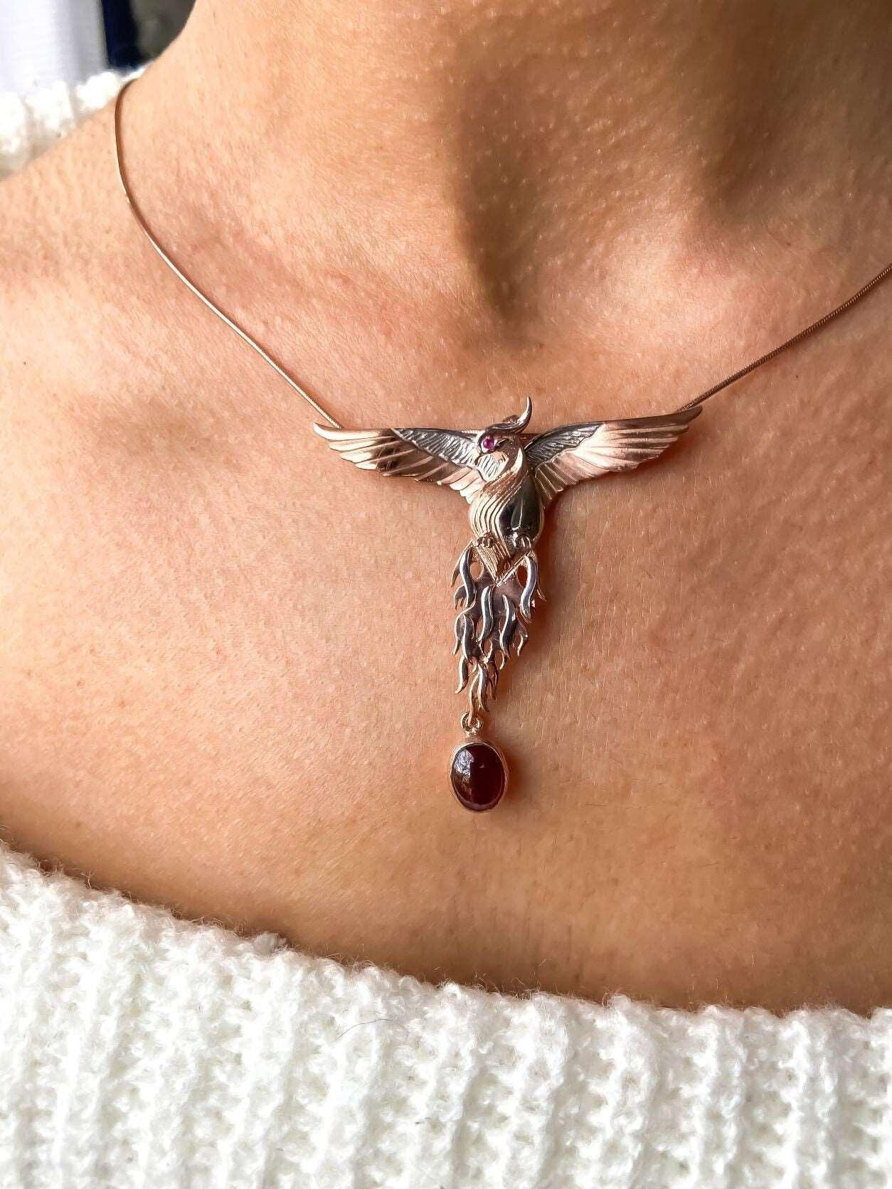 Garnet Stone Handmade Phoenix Root Ruby Eye Silver Necklace, Garnet GeGarnet Gemstone Our phoenix is ​​925 sterling silver and it is completely handcrafted. The eyes you see on it are decorated with red ruby. It is specially designed tNecklaceGarnet Stone