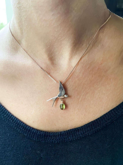 Handmade Peridot Swallow Bird Necklace, 925 Sterling Silver Swallow PePeridot Stone Our sparrow bird Necklace. Designs were designed by our design team. It is completely handcrafted by our craftsmen. These completely special design penHandmade Peridot Swallow Bird Necklace