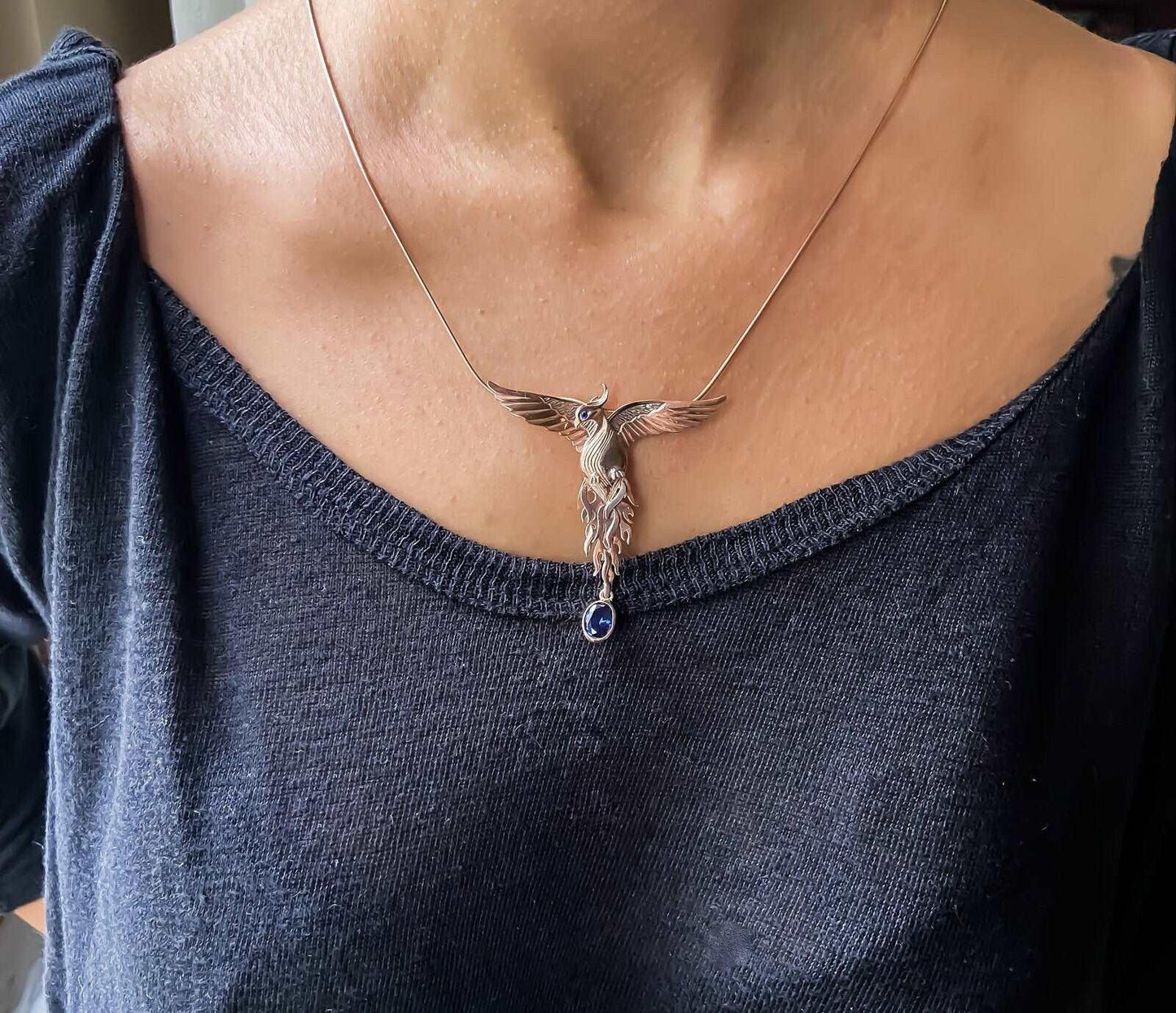 Phoenix Strength Sapphire Stone Firebird 925 Sterling Silver Pendant, Sapphire Gemstone Our phoenix is ​​925 sterling silver and it is completely handcrafted. The eyes you see on it are decorated with Blue sapphire. It is specially desPhoenix Strength Sapphire Stone