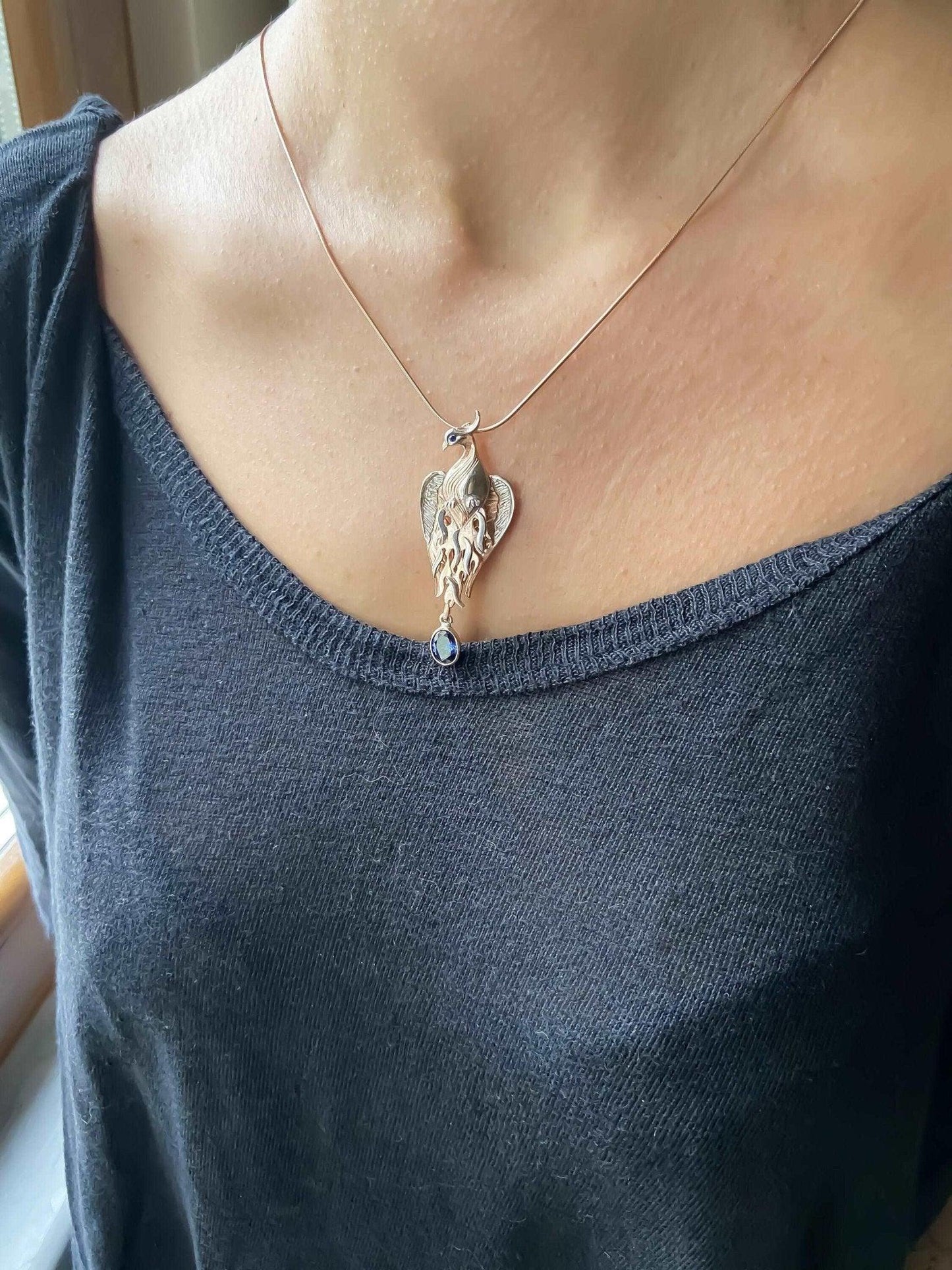 Phoenix Strength Sapphire Stone Firebird 925 Sterling Silver Pendant, Sapphire Gemstone Our phoenix is ​​925 sterling silver and it is completely handcrafted. The eyes you see on it are decorated with Blue sapphire. It is specially desPhoenix Strength Sapphire Stone