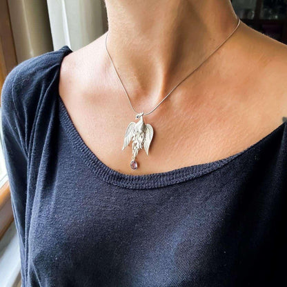 Pure Silver Firebird Strength Phoenix 925 Sterling Silver Necklace, HaAmethyst Stone Sapphire Eye Pure Silver Our phoenix is ​​925 sterling silver and it is completely handcrafted. The eyes you see on it are decorated with Blue sapphirPure Silver Firebird
