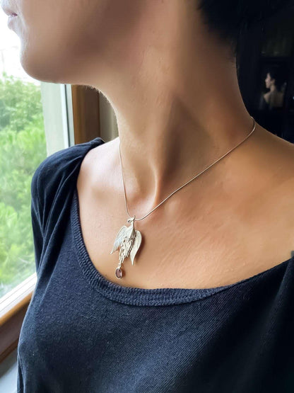 Pure Silver Firebird Strength Phoenix 925 Sterling Silver Necklace, HaAmethyst Stone Sapphire Eye Pure Silver Our phoenix is ​​925 sterling silver and it is completely handcrafted. The eyes you see on it are decorated with Blue sapphirPure Silver Firebird