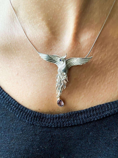 Pure Silver Firebird Strength Phoenix 925 Sterling Silver Necklace, HaAmethyst Stone Sapphire Eye Pure Silver Our phoenix is ​​925 sterling silver and it is completely handcrafted. The eyes you see on it are decorated with Blue sapphirPure Silver Firebird