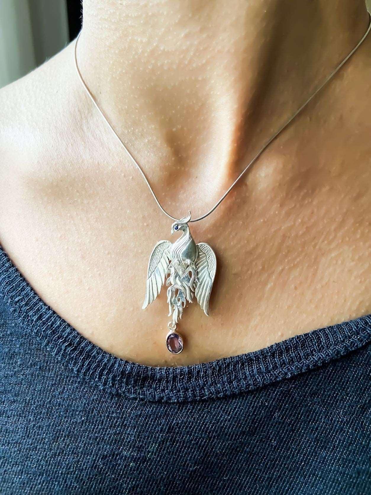 Pure Silver Firebird Strength Phoenix 925 Sterling Silver Necklace, HaAmethyst Stone Sapphire Eye Pure Silver Our phoenix is ​​925 sterling silver and it is completely handcrafted. The eyes you see on it are decorated with Blue sapphirPure Silver Firebird
