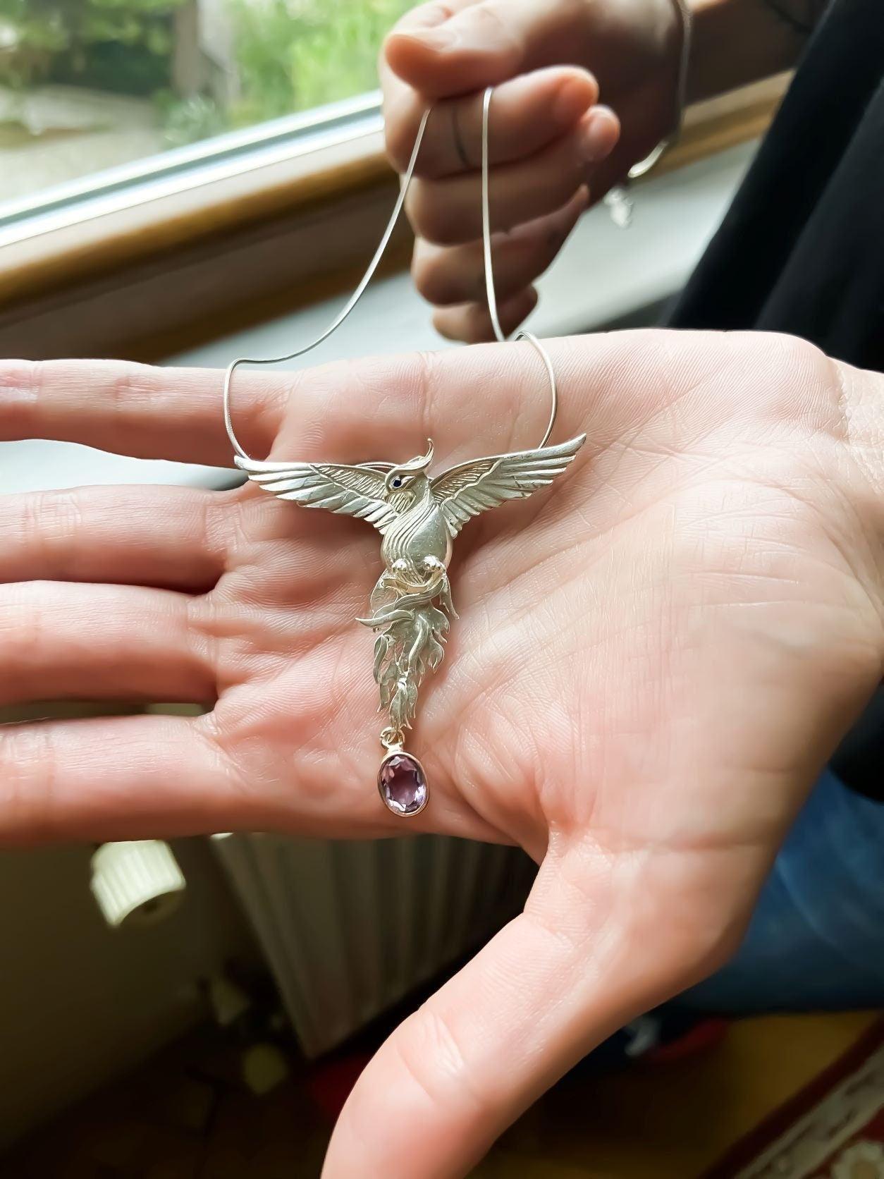 Pure Silver Firebird Strength Phoenix 925 Sterling Silver Necklace, HaAmethyst Stone Sapphire Eye Pure Silver Our phoenix is ​​925 sterling silver and it is completely handcrafted. The eyes you see on it are decorated with Blue sapphirPure Silver Firebird