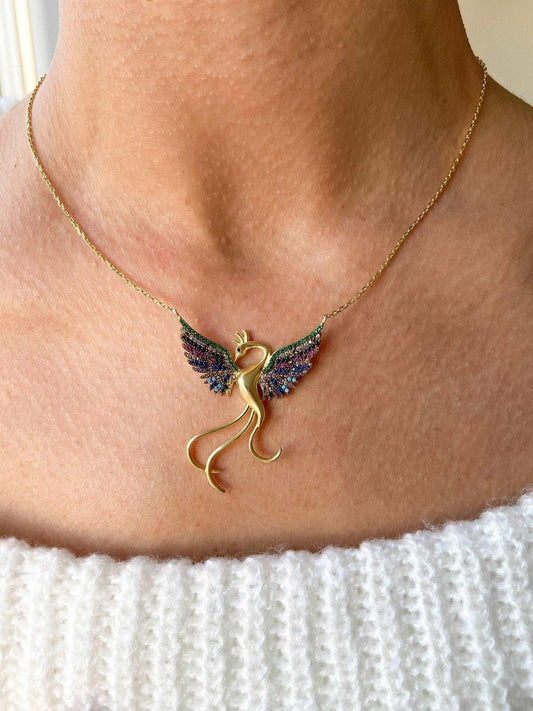 Rainbow Phoenix Gold Planet Necklace 925 Sterling Silver, Custom DesinWe designed our 925 sterling silver firebird necklace for you. It is completely handcrafted and made of sterling silver. It is decorated with gold planet and coloredNecklaceRainbow Phoenix Gold Planet Necklace