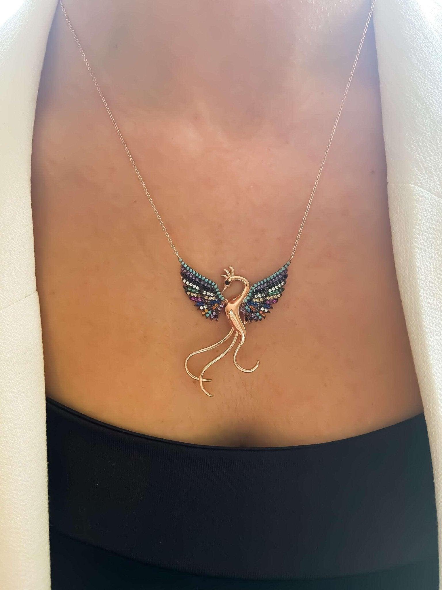 Rainbow Phoenix Necklace,Custom Desing Firebird Handmade Jewelry StrenWe designed our 925 carat fire bird necklace for you. It is completely handcrafted and made of sterling silver. It is decorated with rose gold and colored zircon stoRainbow Phoenix Necklace