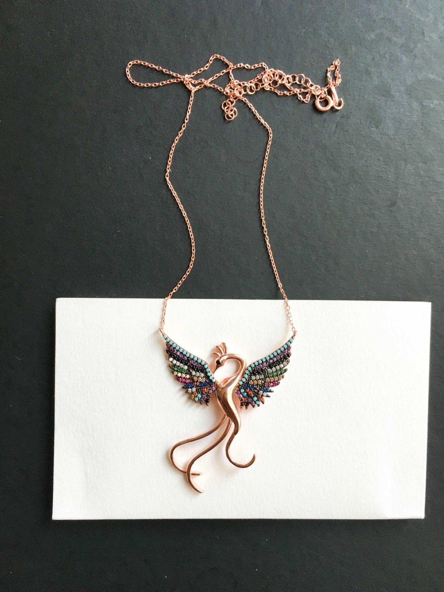 Rainbow Phoenix Necklace,Custom Desing Firebird Handmade Jewelry StrenWe designed our 925 carat fire bird necklace for you. It is completely handcrafted and made of sterling silver. It is decorated with rose gold and colored zircon stoRainbow Phoenix Necklace