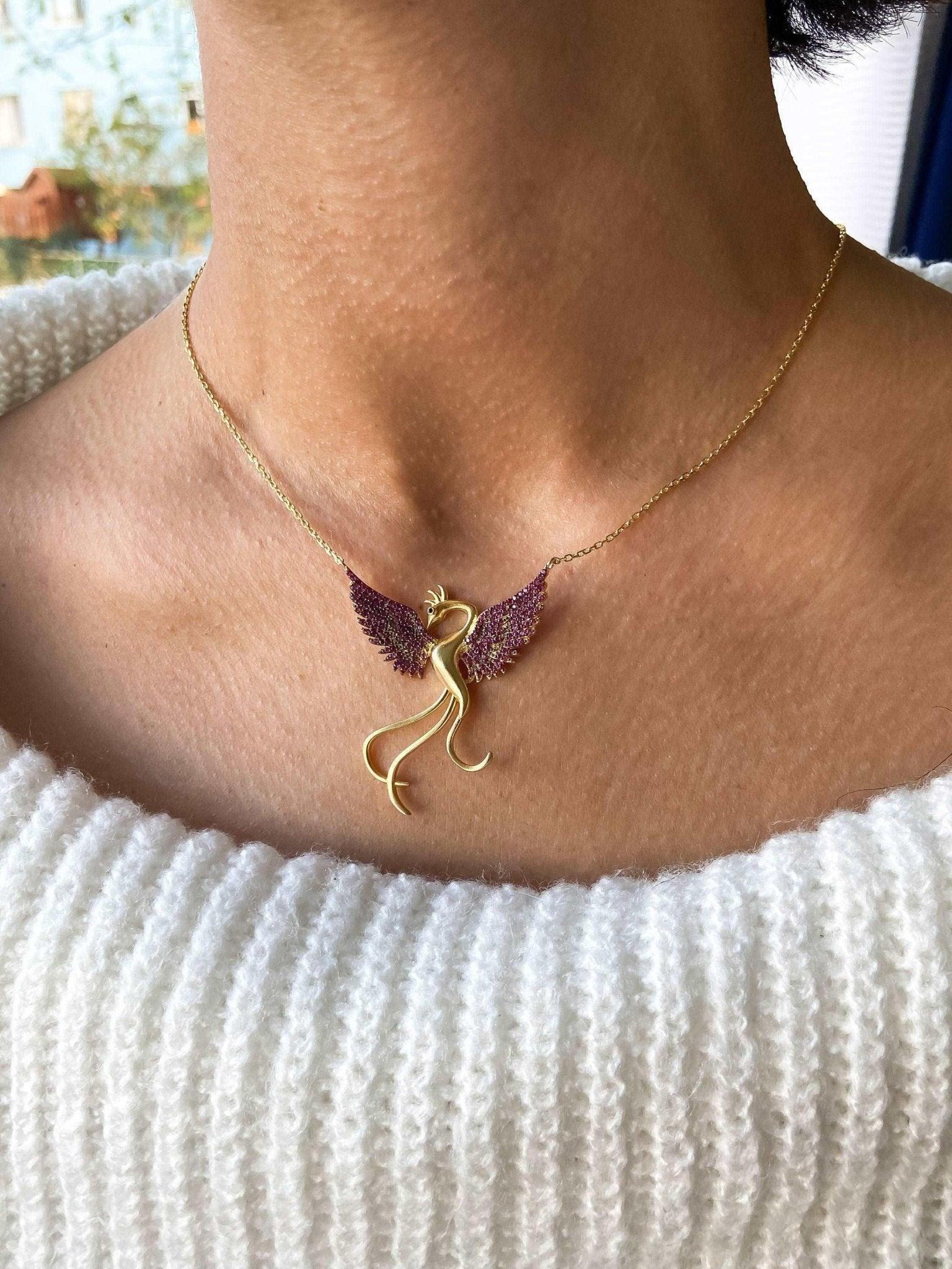 Red Phoenix Gold Planet Handmade Necklace, Gold Firebird 925 Sterling We designed our 925 carat fire bird necklace for you. It is completely handcrafted and made of sterling silver. It is decorated with Gold Planet and Red colored zircNecklaceRed Phoenix Necklace