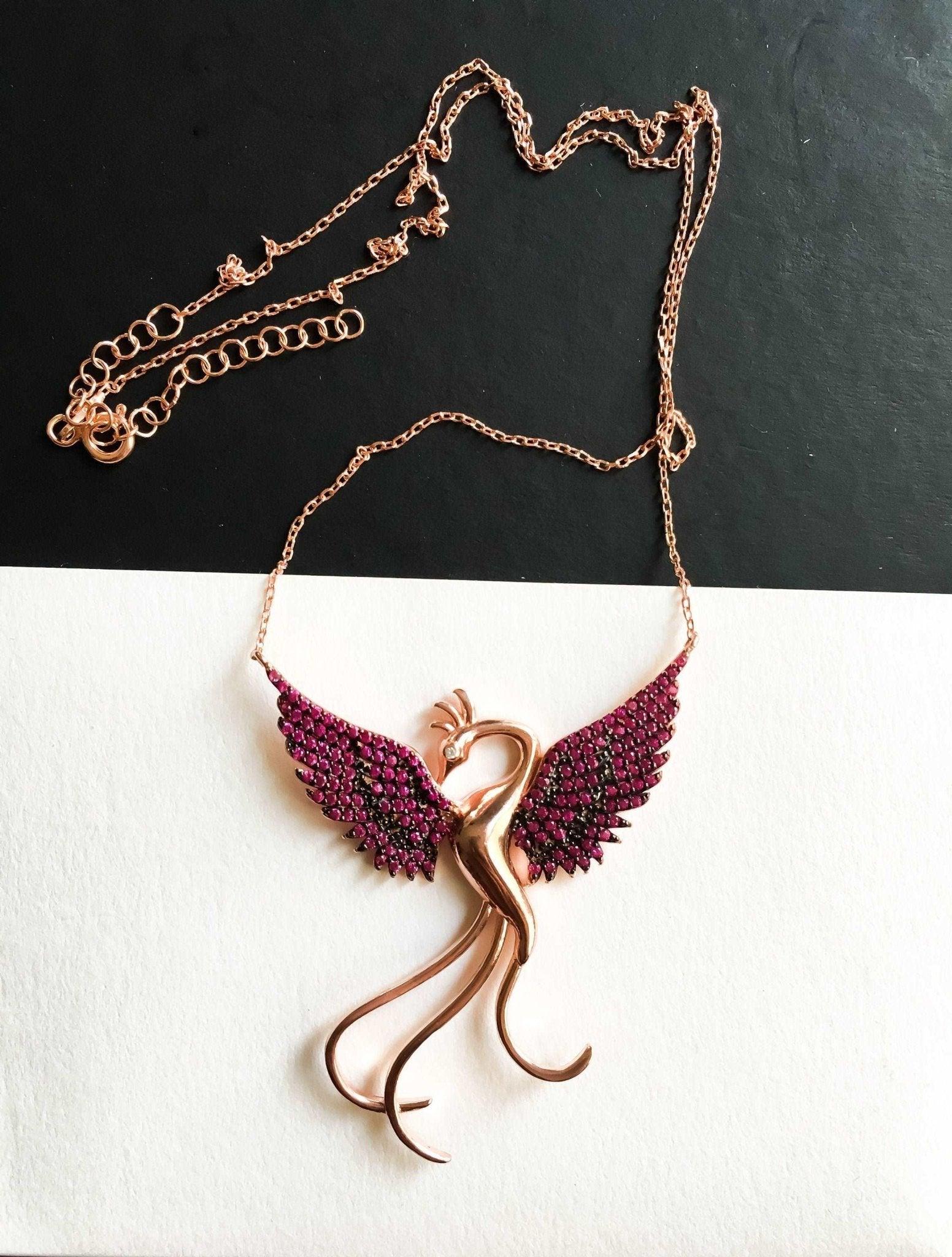 Red Phoenix Handmade Necklace, Bird Jewelry Rose Gold Firebird PendantWe designed our 925 carat fire bird necklace for you. It is completely handcrafted and made of sterling silver. It is decorated with rose gold and Purple colored zirRed Phoenix Handmade Necklace