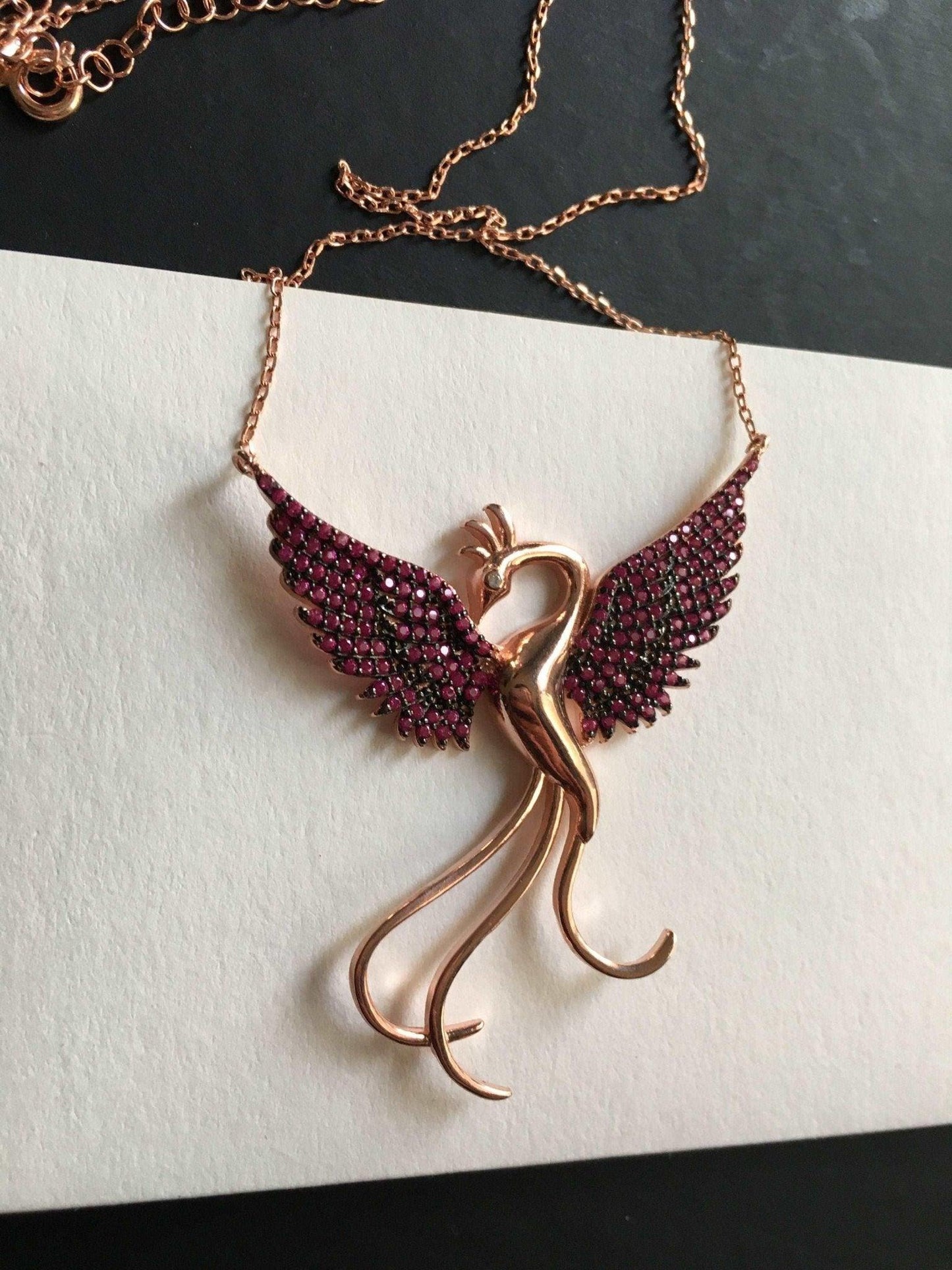 Red Phoenix Handmade Necklace, Bird Jewelry Rose Gold Firebird PendantWe designed our 925 carat fire bird necklace for you. It is completely handcrafted and made of sterling silver. It is decorated with rose gold and Purple colored zirRed Phoenix Handmade Necklace