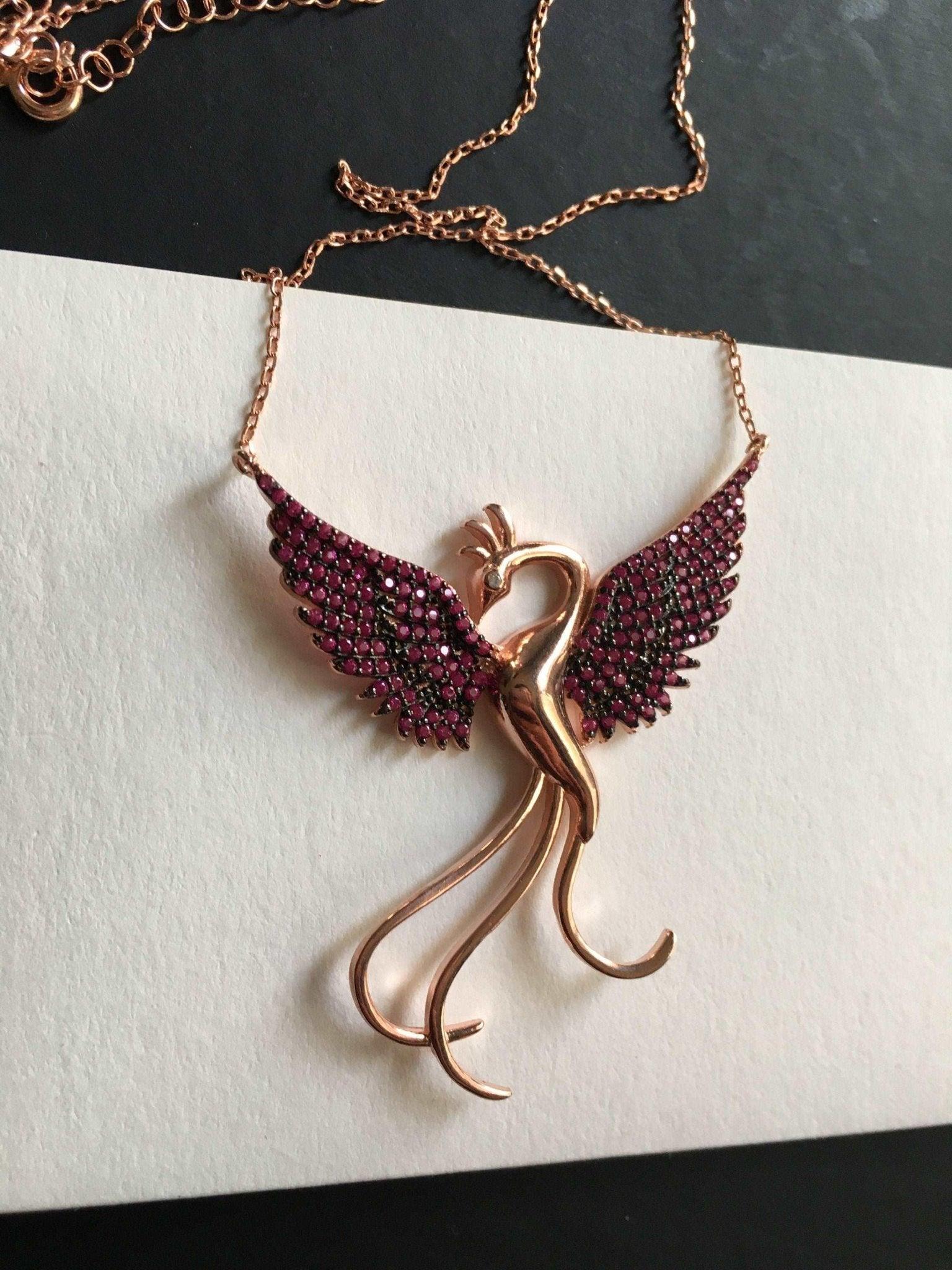 Red Phoenix Handmade Necklace, Bird Jewelry Rose Gold Firebird PendantWe designed our 925 carat fire bird necklace for you. It is completely handcrafted and made of sterling silver. It is decorated with rose gold and Purple colored zirRed Phoenix Handmade Necklace