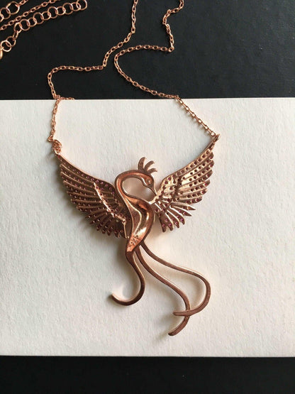 Red Phoenix Handmade Necklace, Bird Jewelry Rose Gold Firebird PendantWe designed our 925 carat fire bird necklace for you. It is completely handcrafted and made of sterling silver. It is decorated with rose gold and Purple colored zirRed Phoenix Handmade Necklace