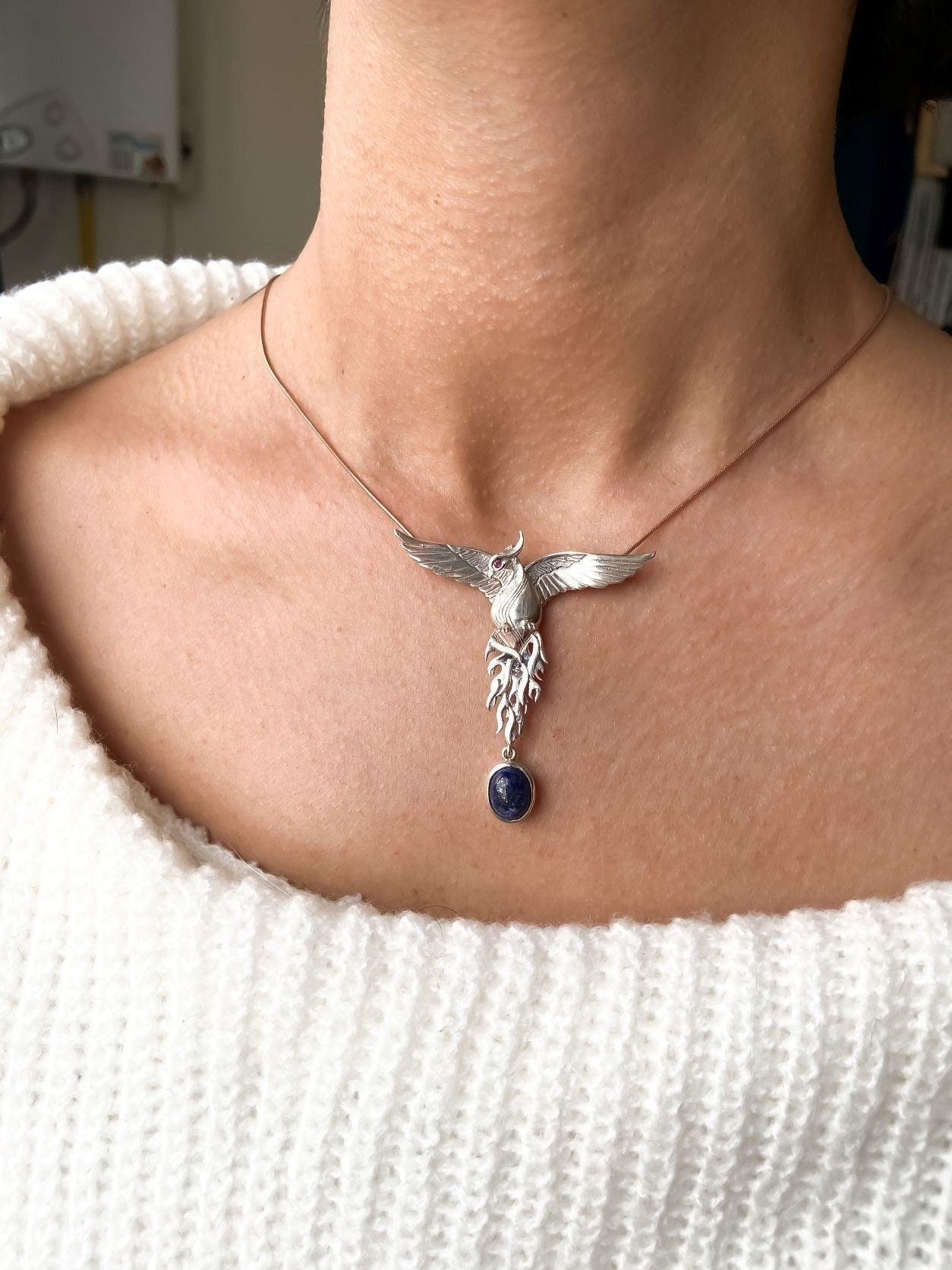 Silver Lapis Lazuli Phoenix Strength Necklace, Sapphire Stone or Root Lapis Lazuli Stone Sapphire or Root Ruby Eyes Pure Silver Our phoenix is ​​925 sterling silver and it is completely handcrafted. The eyes you see on it are decoratedSilver Lapis Lazuli