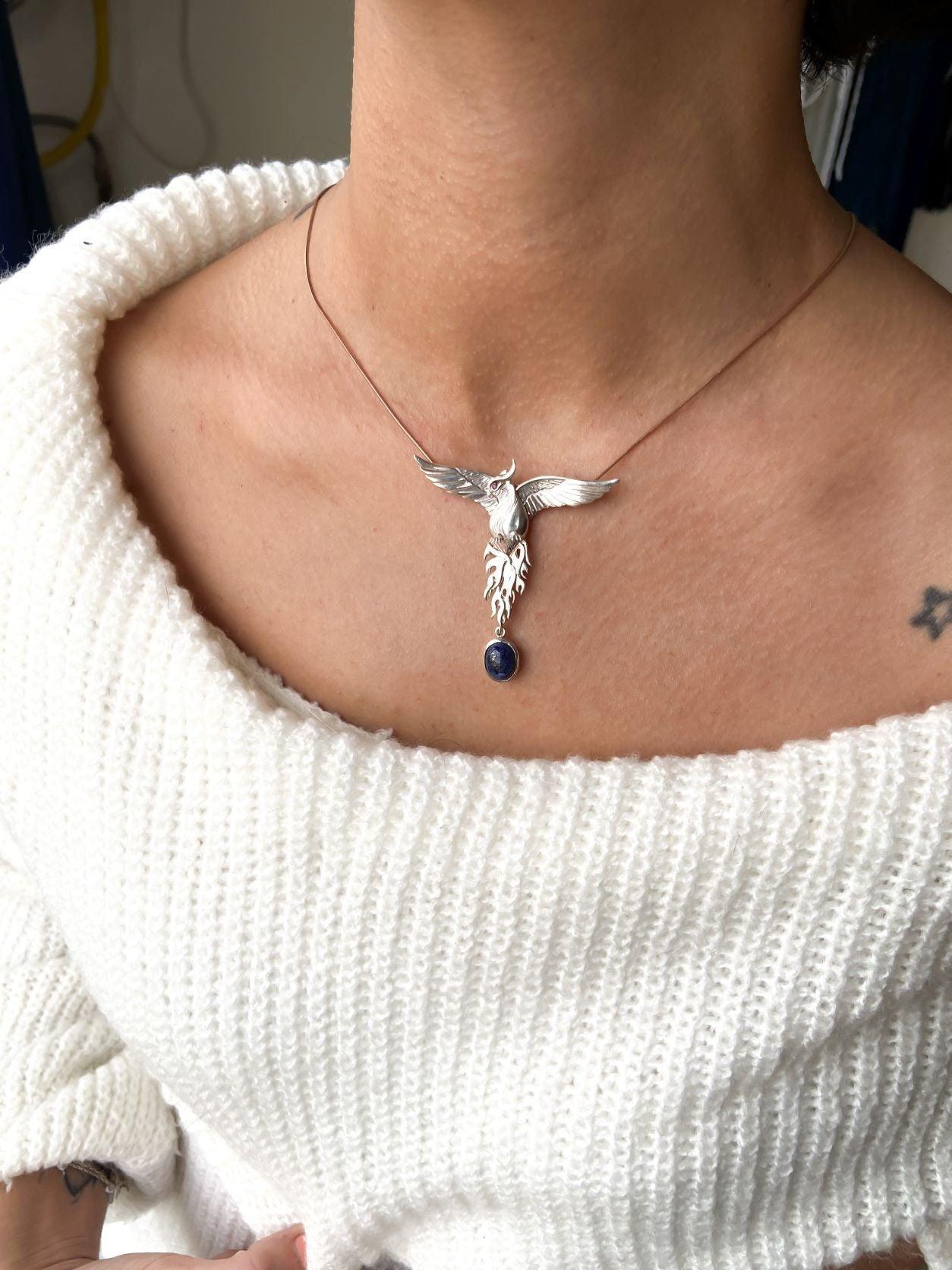 Silver Lapis Lazuli Phoenix Strength Necklace, Sapphire Stone or Root Lapis Lazuli Stone Sapphire or Root Ruby Eyes Pure Silver Our phoenix is ​​925 sterling silver and it is completely handcrafted. The eyes you see on it are decoratedSilver Lapis Lazuli