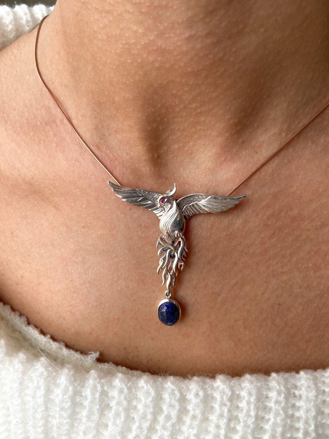 Silver Lapis Lazuli Phoenix Strength Necklace, Sapphire Stone or Root Lapis Lazuli Stone Sapphire or Root Ruby Eyes Pure Silver Our phoenix is ​​925 sterling silver and it is completely handcrafted. The eyes you see on it are decoratedSilver Lapis Lazuli