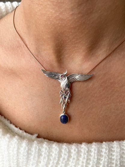 Silver Lapis Lazuli Phoenix Strength Necklace, Sapphire Stone or Root Lapis Lazuli Stone Sapphire or Root Ruby Eyes Pure Silver Our phoenix is ​​925 sterling silver and it is completely handcrafted. The eyes you see on it are decoratedSilver Lapis Lazuli